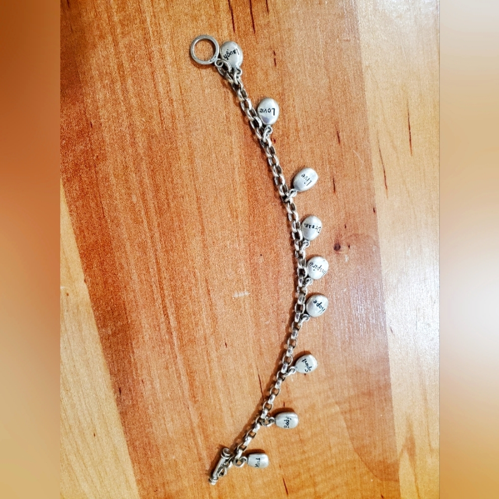 Silver charm bracelet with inspiring words